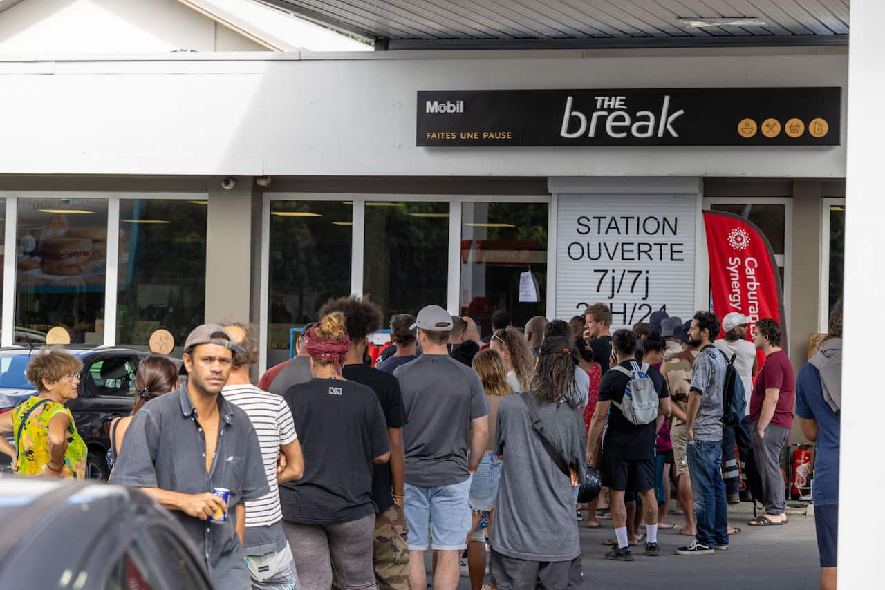 Queue outside a petrol station.