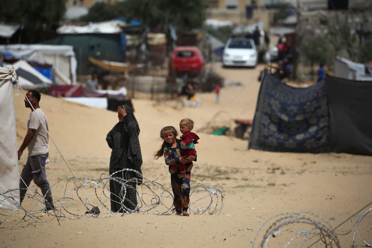 Children walking along the border with Egypt.