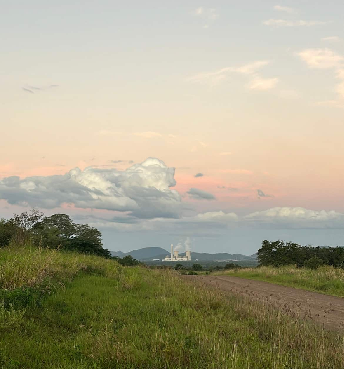 Countryside with a power station on the horizon