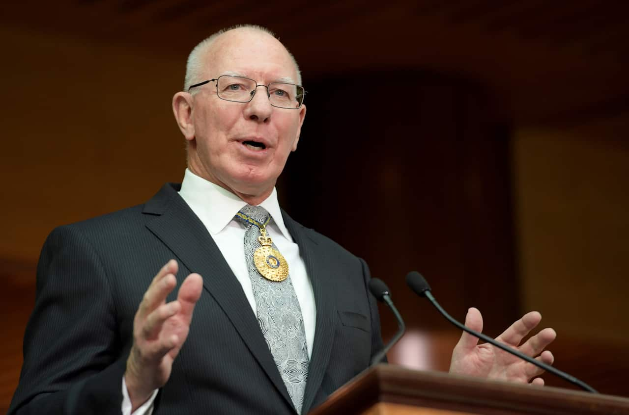 Governor-General David Hurley wearing a suit and speaking from behind a lectern