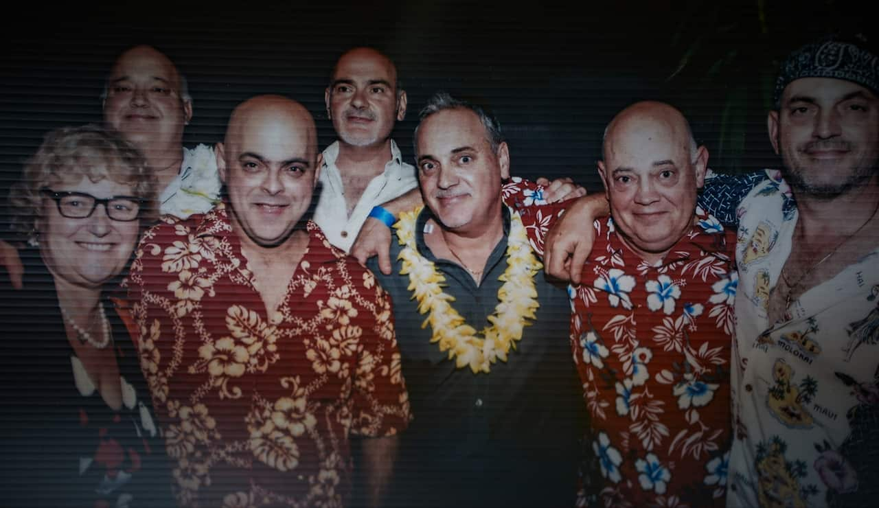 A group of seven siblings in holiday clothing.