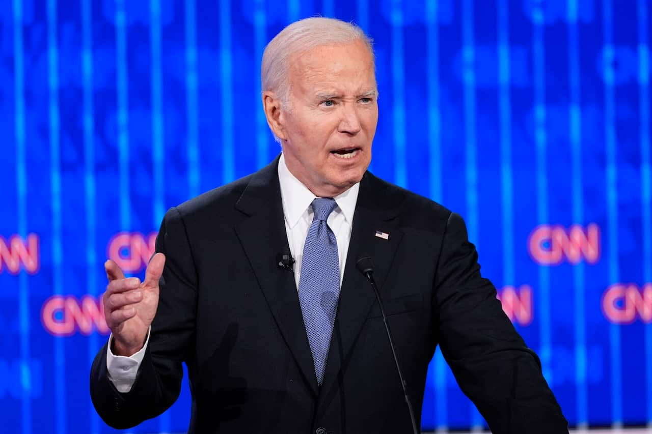 Joe Biden speaking at a lectern