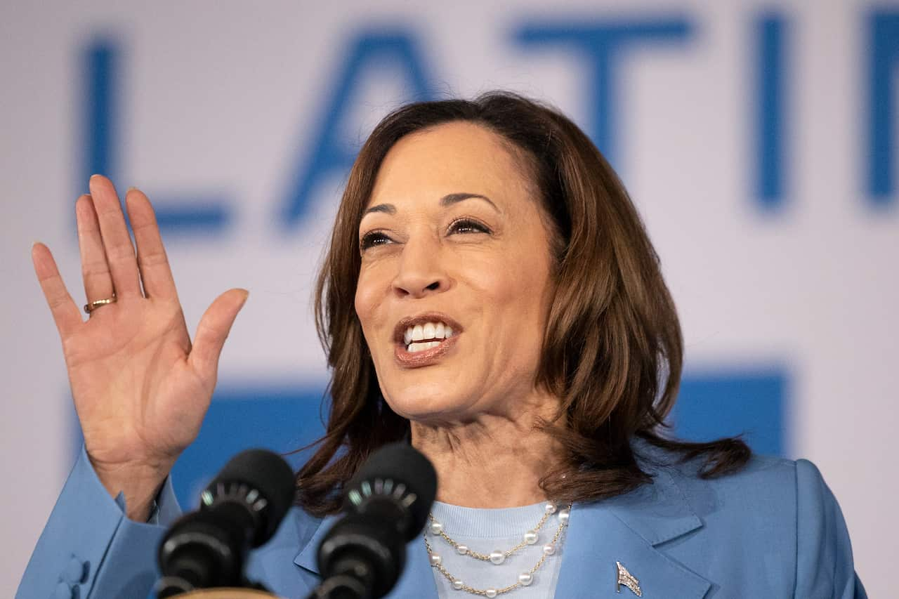 US vice president Kamala Harris wearing a blue blazer and blue top.