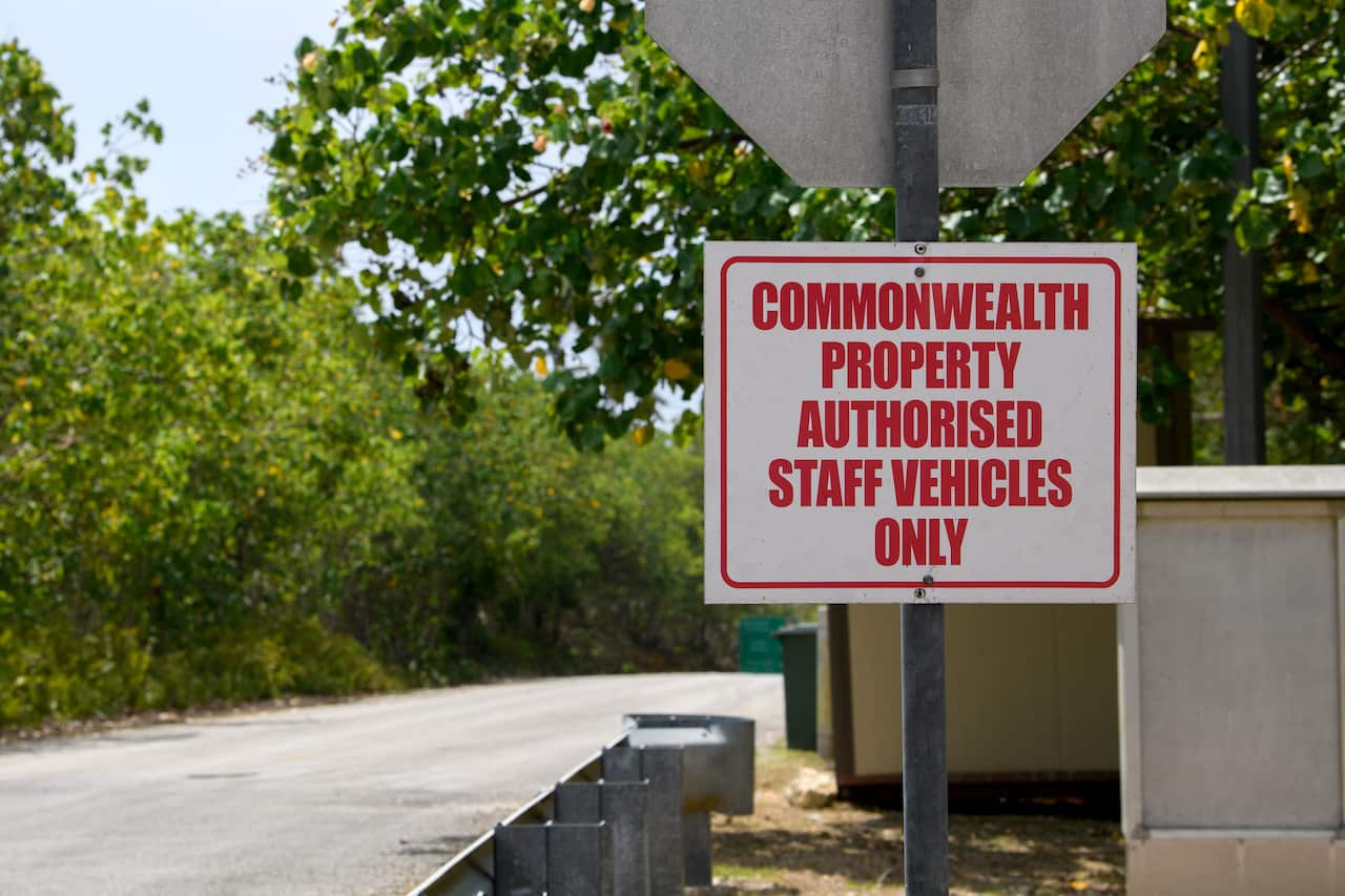 Signage saying "Commonwealth property Authorised Staff Vehicles only" at the entrance of the Christmas Island Australian Immigration Detention Centre in Christmas Island