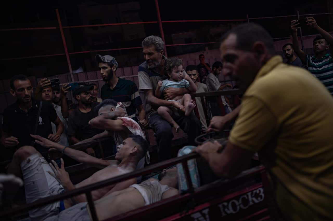 Image of Palestinians injured in an Israeli strike arriving at the Nasser Hospital.