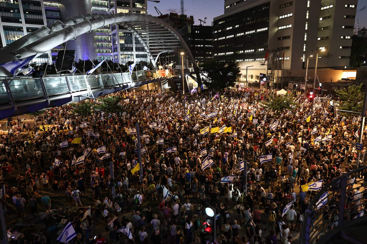 A large crowd of protesters in a city centre.