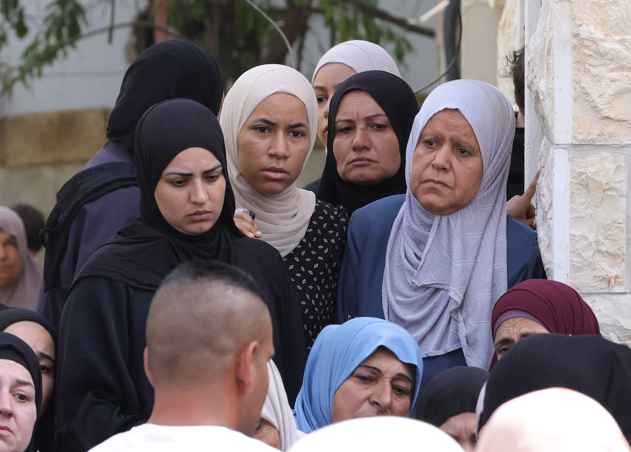 A group of women looking sad.