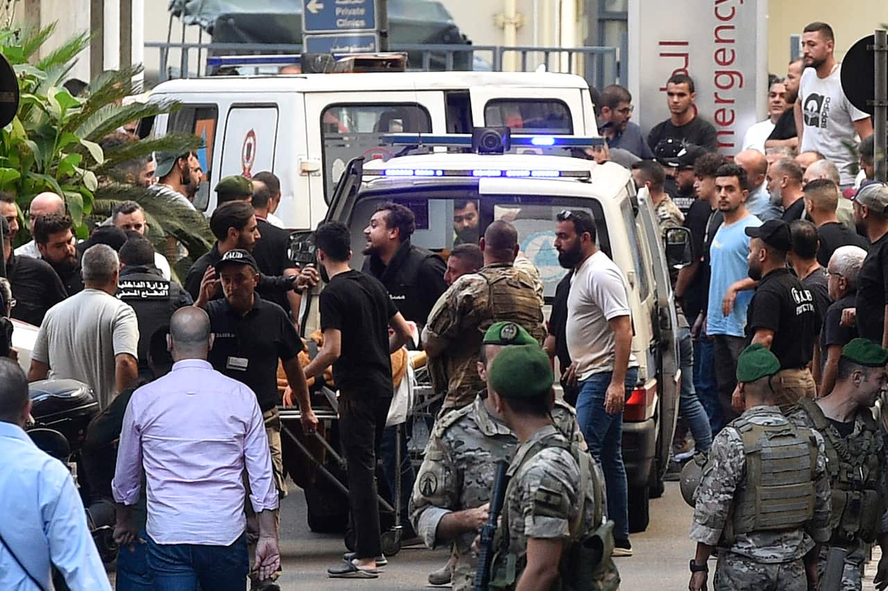 People gather around ambulances outside a hospital in Lebanon