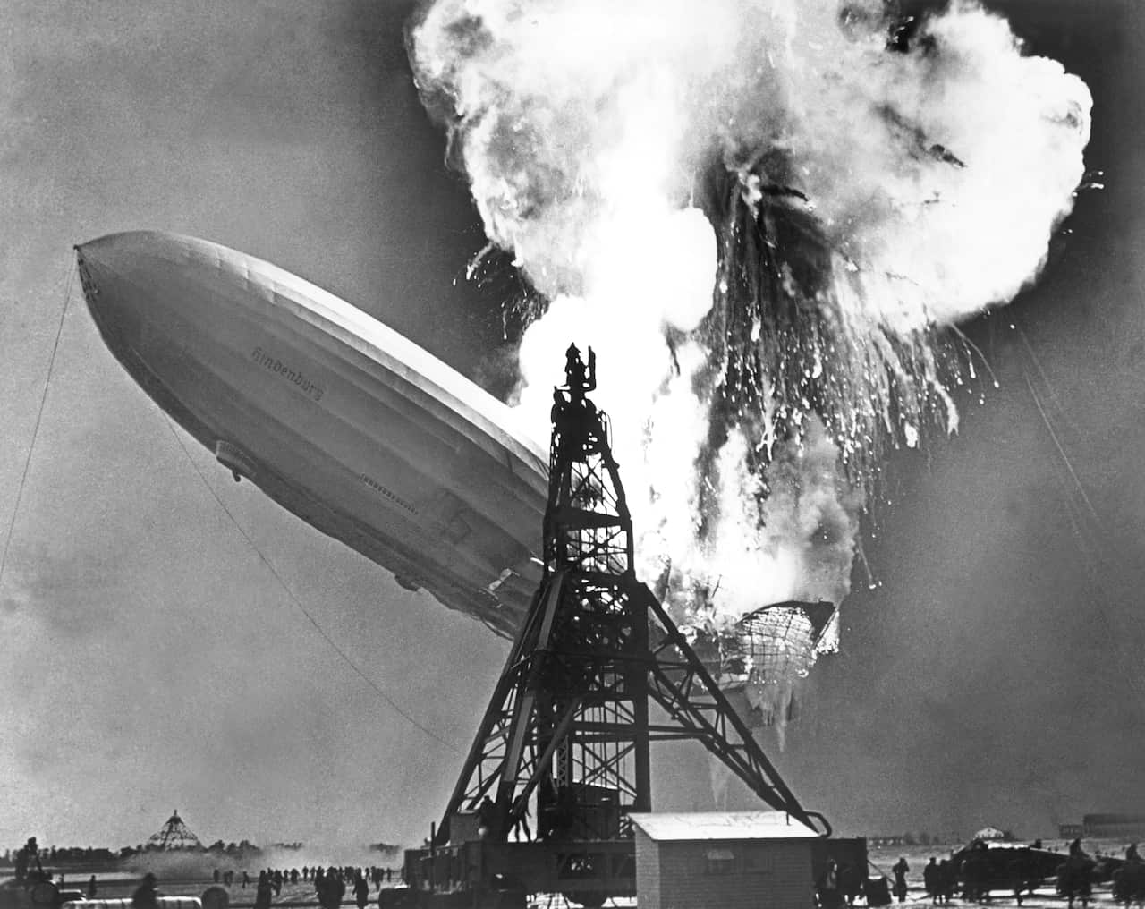 A huge explosion as an airship collides with a mooring tower