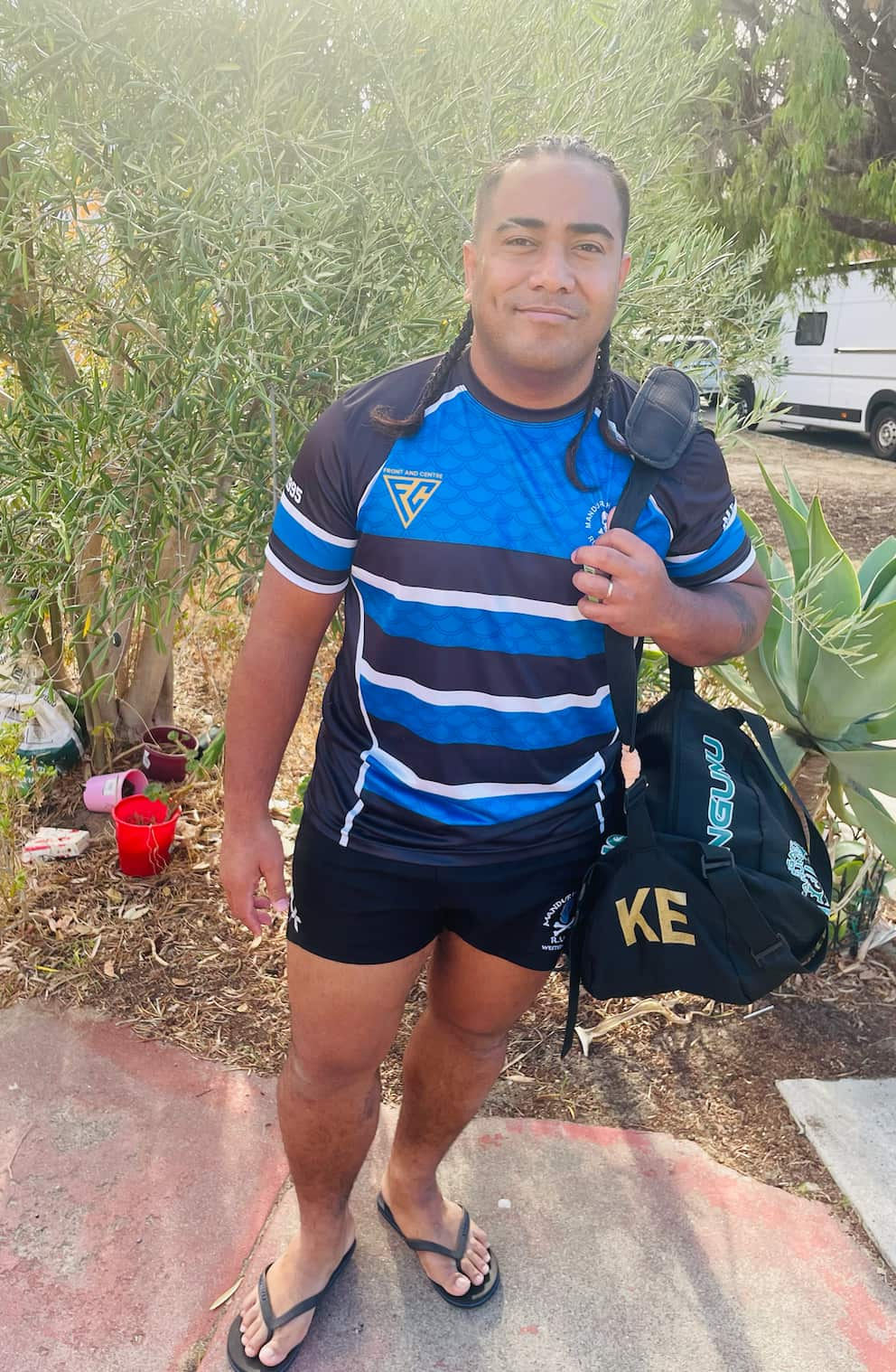 A man in a striped blue rugby jersey.