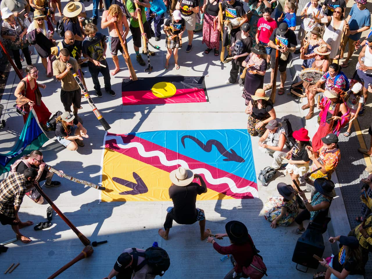 Didgeridoo flash mob mining protest 