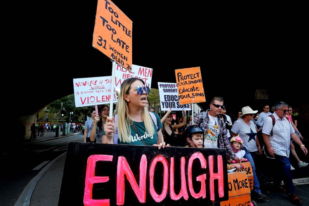 A group of people holding placards.