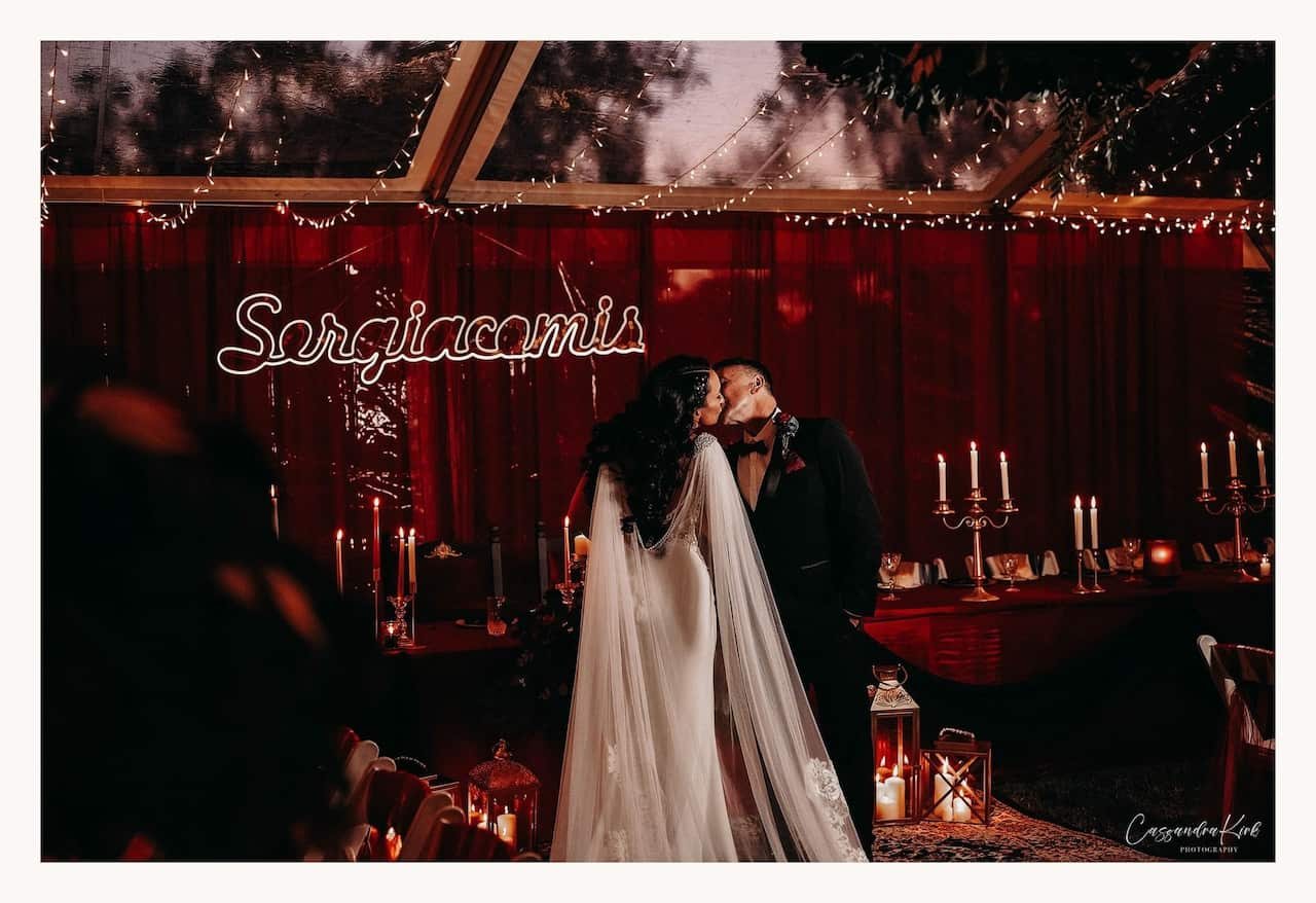 a couple kissing on their wedding day