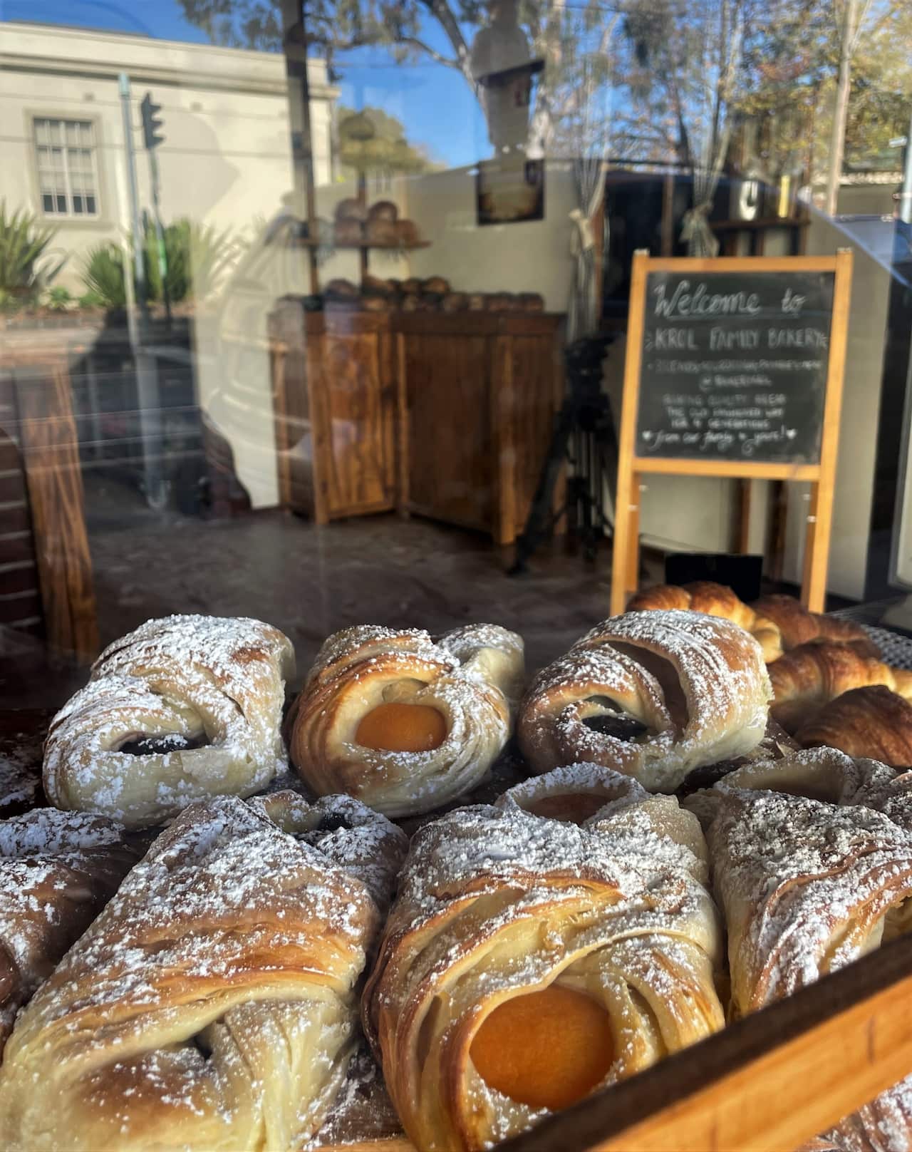 Danish pastries in a shopfront window.