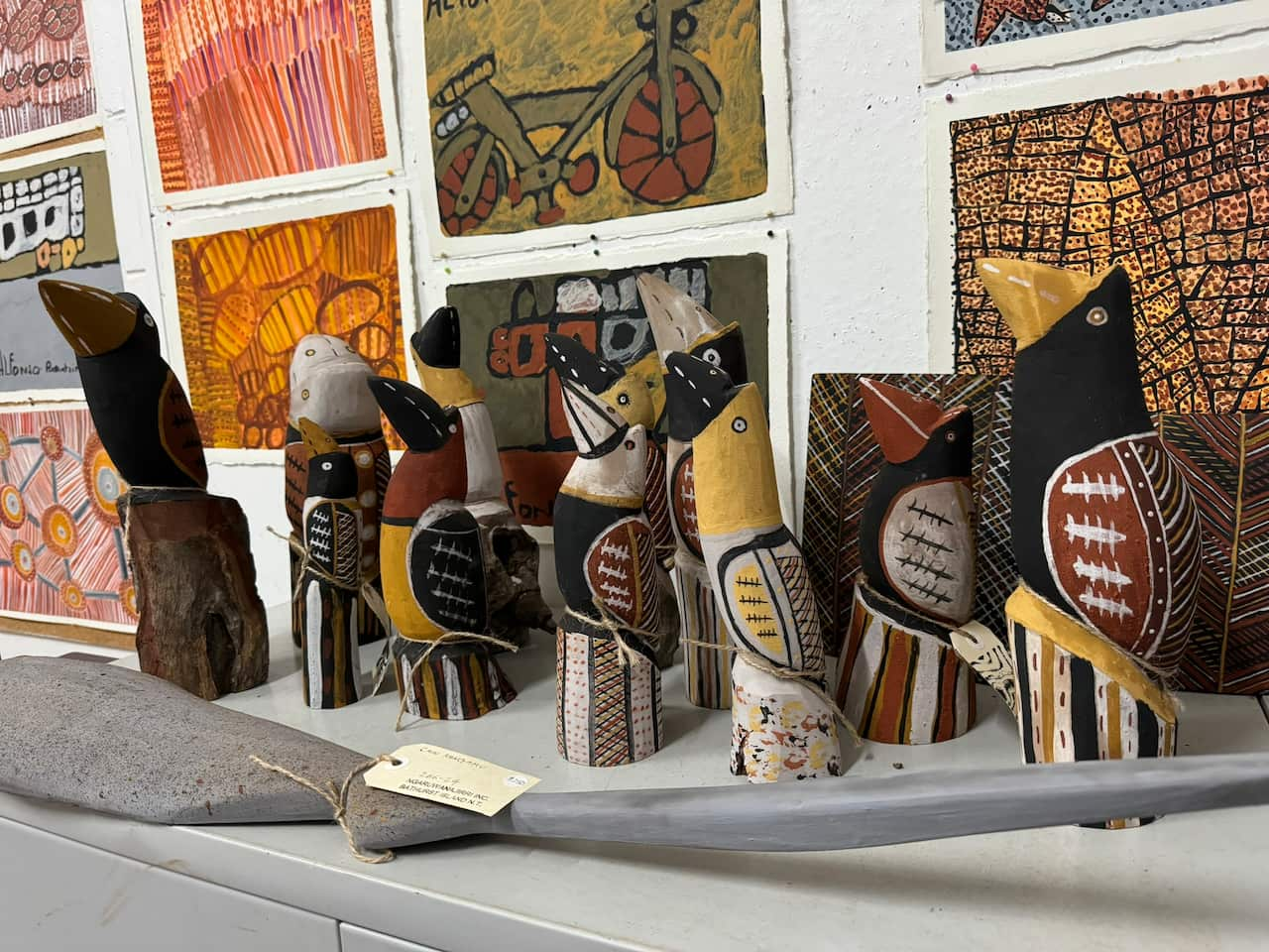 Carvings and paintings created by artists at the Ngaruwanajirri Art Centre which is supported by NDIS.