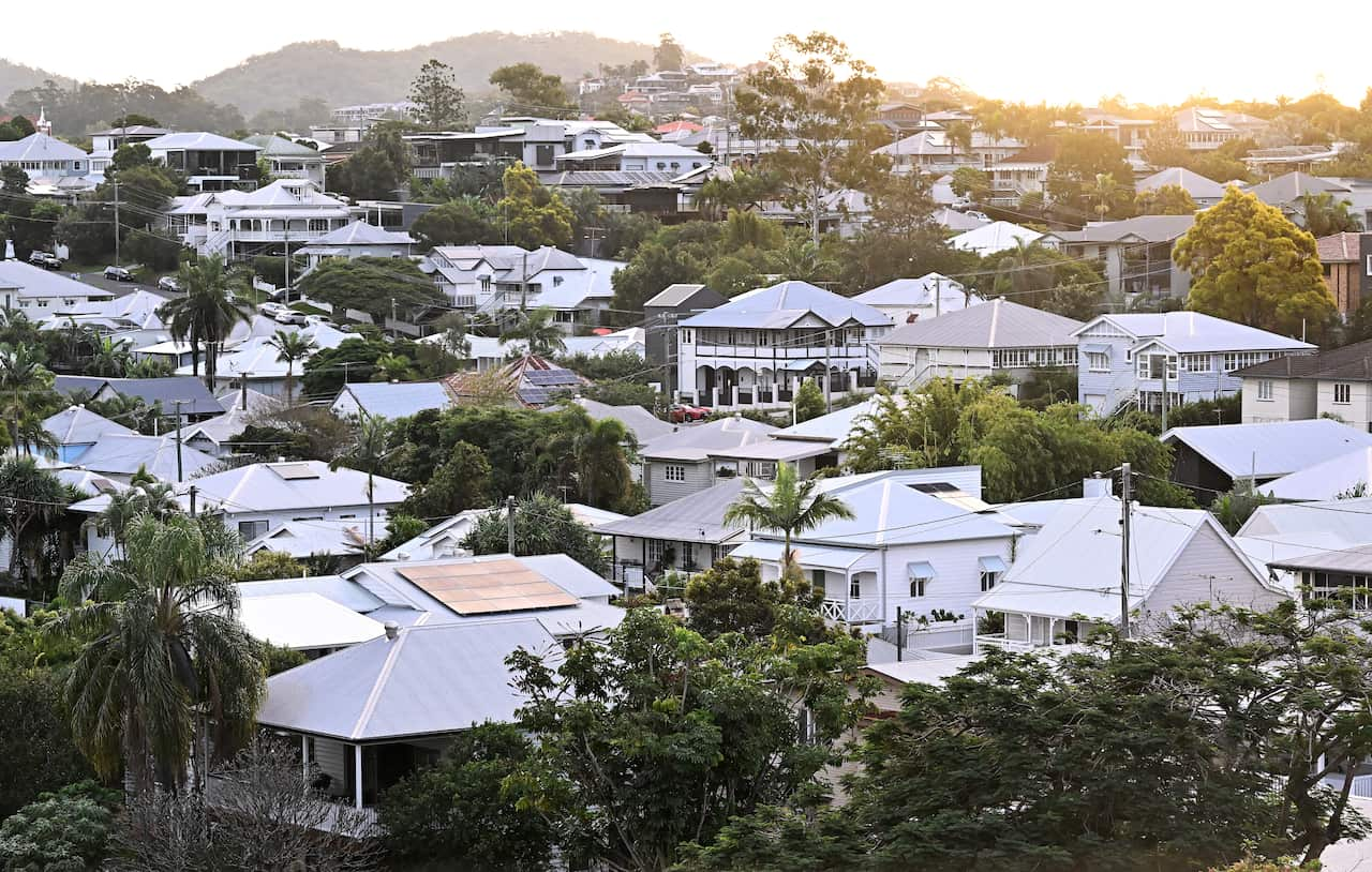 An image of homes, mostly roofs are shown