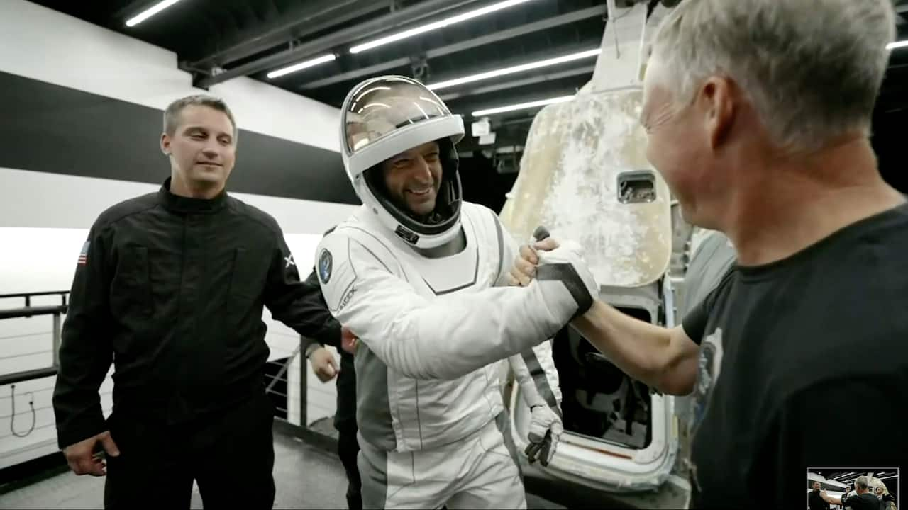 Jared Isaacman is greeted as he gets out of the space capsule upon his return from space.