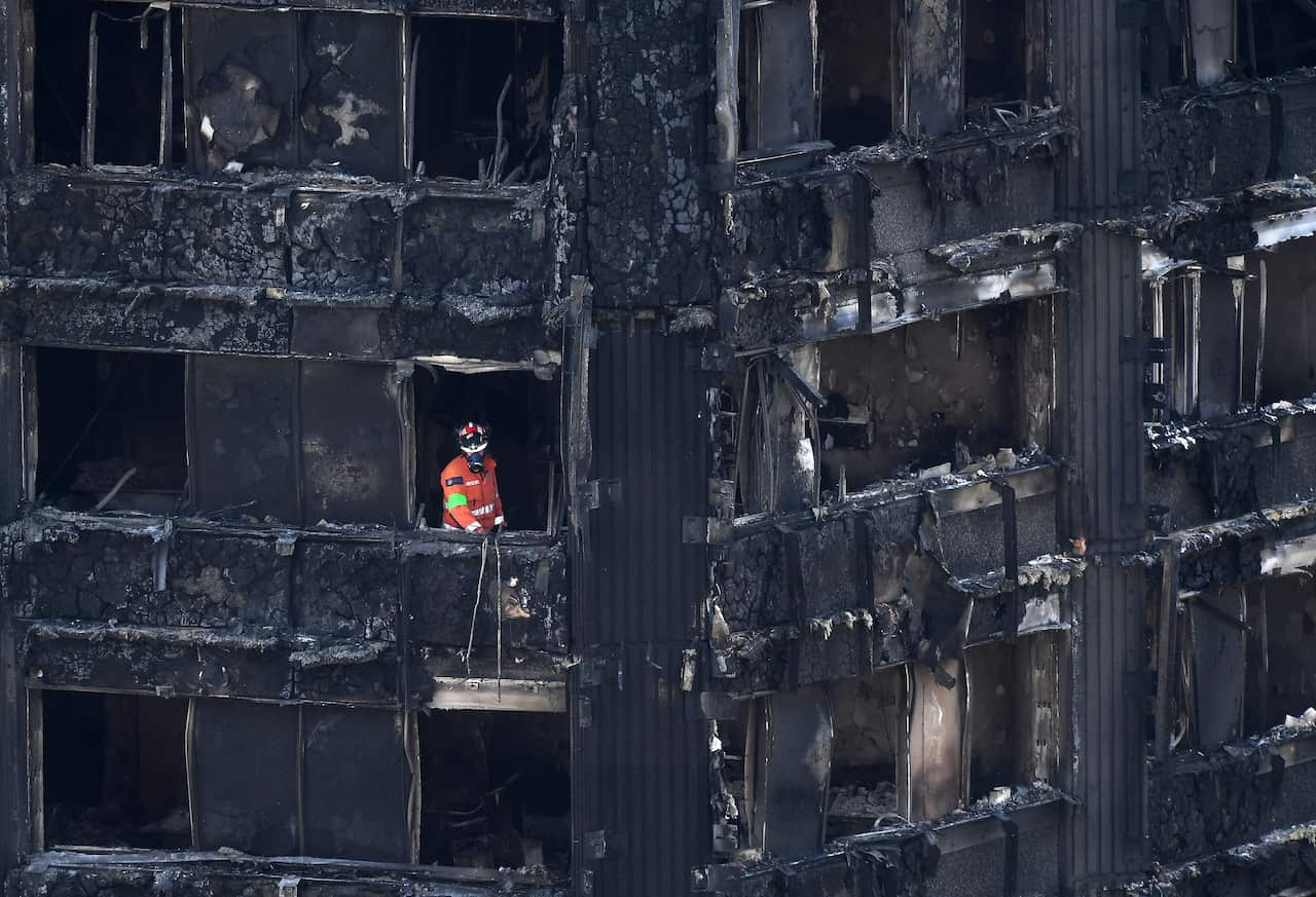 A search and rescue worker inside a scorched building. 