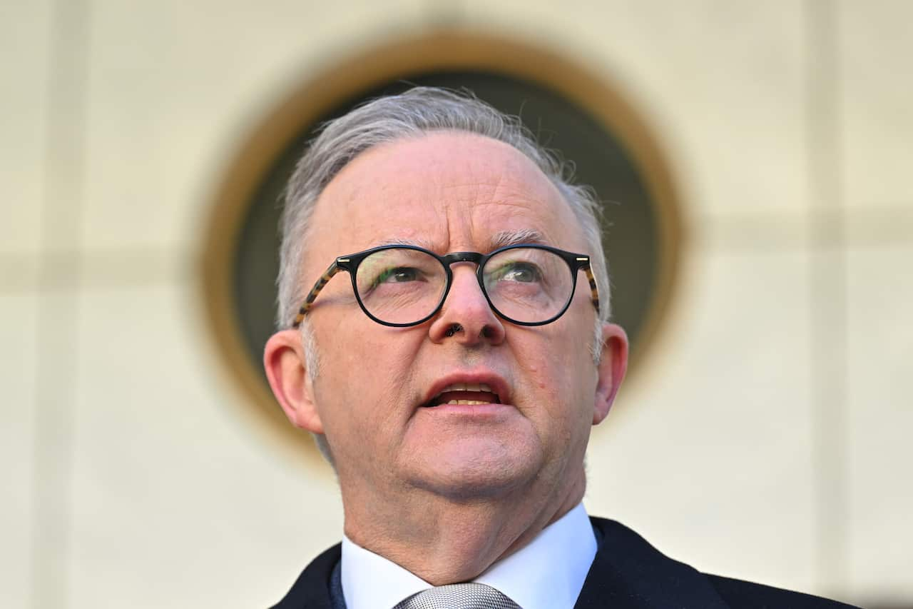 Anthony Albanese speaking, wearing a suit and tie.