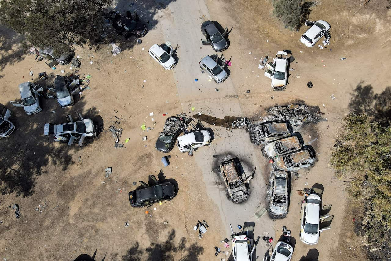 An aerial photo shows abandoned and burned cars at the site of the October 7 attack.