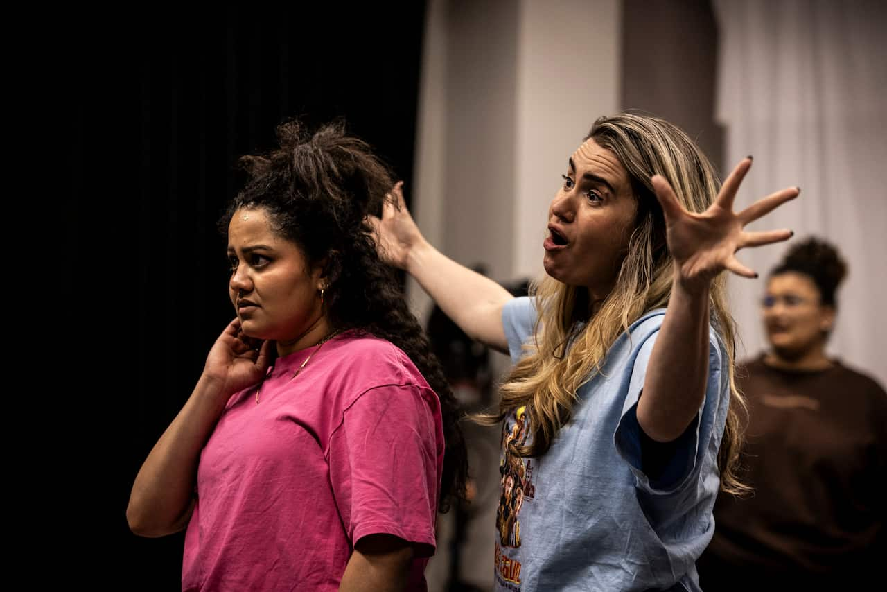 Two women rehearsing for a musical